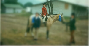 picture of author winning first place at a horse show, it was not a rewarding experience